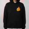 Black Hamster Dinosaur Hoodie seen from the front featuring an adorable cartoon hamster wearing an orange T-Rex dinosaur costume printed on the chest.