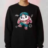 Model wearing a black sweatshirt with a cute pink-and-teal street-style Bunny Cartoon Sweatshirt graphic.