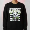 Model wearing a black Street Panda Cartoon Sweatshirt a cartoon panda in streetwear and graffiti-style “Street Panda” text.