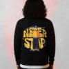 never stop printed sweatshirt Black cartoon with a character illustration and Never Stop text on the back